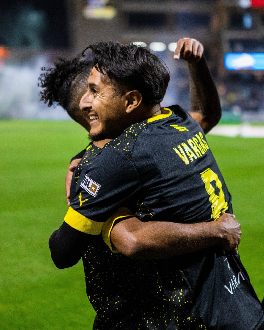 Marlon Vargas celebrating with Mukwelle Akale after scoring a last-minute goal. Shot by Liliana Esparza.